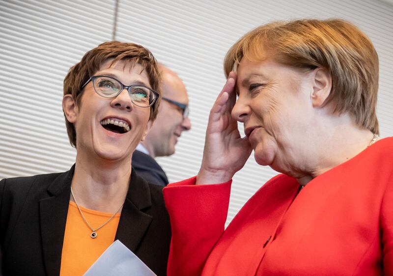 Leader of Germany's conservative Christian Democratic Union (CDU) party Annegret Kramp-Karrenbauer (L) chats with Chancellor Angela Merkel before a session of the CDU/CSU parliamentary group meeting on May 14, 2019 in Berlin.  - Germany OUT
 / AFP / dpa / Michael Kappeler
