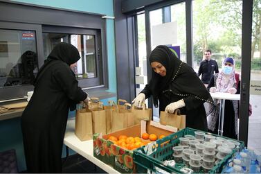  Happy volunteers at the philanthropic 'Iftar for All' project in North London during Ramadan 2020. Getty Images