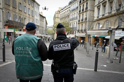 Police officers fly a drone as they patrol on March 24, 2020 in Marseille's Capucins market closed to the public on the eighth day of a strict nationwide lockdown to curb the spread of the COVID-19 infection caused by the novel coronavirus. (Photo by GERARD JULIEN / AFP)