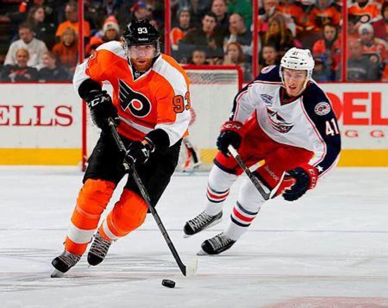 Jakub Voracek, left, of the Philadelphia Flyers takes the puck as Alexander Wennberg of the Columbus Blue Jackets defends on November 22, 2014 at the Wells Fargo Center in Philadelphia, Pennsylvania. Elsa/Getty Images/AFP