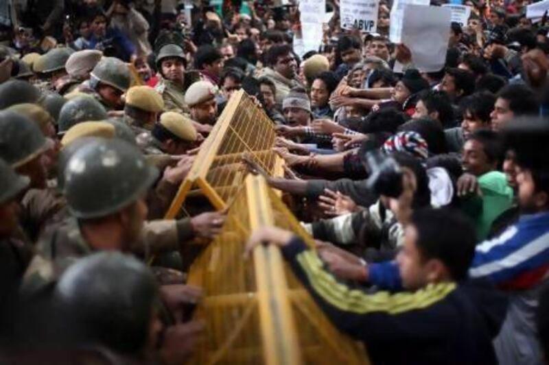 Protesters try to break through a police cordon during a demonstration over the death of a young woman who was recently gang-raped on a moving bus in New Delhi.