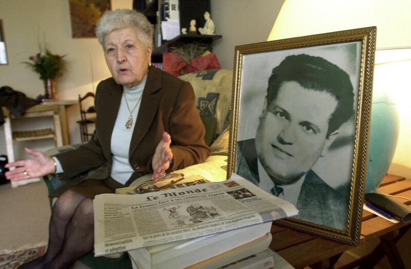 (FILES) In this file photo taken on May 5, 2001 Malika Boumendjel, widow of Algerian lawyer Ali Boumendjel gives an intervie at her home in Puteaux, on her husband's death during his 43 days detention by the French army on March 23, 1957. French President Emanuel Macron admits on March 2, 2021 that underground resistance Algerian Liberation Front (FLN) lawyer Ali Boumendjel was "tortured and murdered" by the French army during the war in Algeria. / AFP / Eric Feferberg
