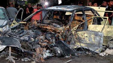A damaged vehicle at the site of a bomb blast in Damascus on July 27. Reuters