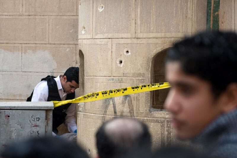 The two attackers opened fire at the entrance to the church of Mar Mina in Helwan district, which was being guarded by police in the run-up to Orthodox Christmas celebrations next week, security sources said.  Mohamed Hossam / EPA