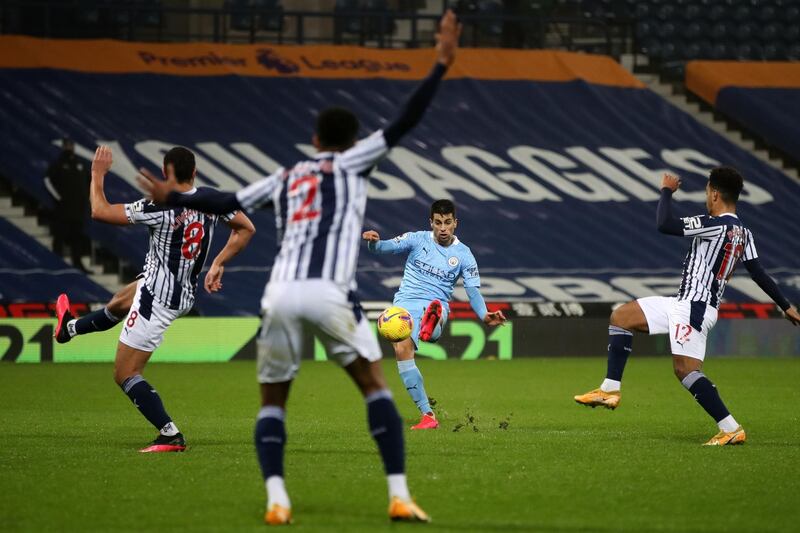 Manchester City's Portuguese defender Joao Cancelo scores his team's second goal.