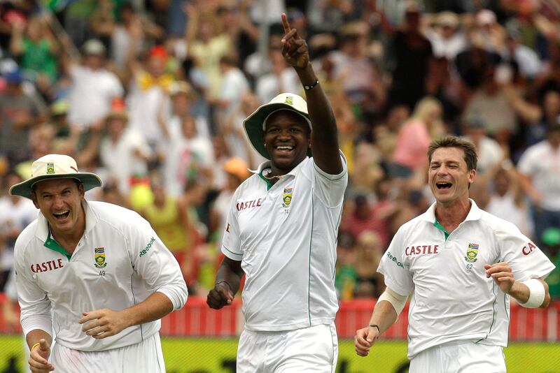 South Africa's fielder Lonwabo Tsotsobe, centre reacts with teammates Graeme Smith, left, and Dale Steyn, right, after taking a catch to dismiss  India's batsman Vangipurappu Venkata Sai Laxman, unseen, on the first day of the second cricket test match at the Kingsmead stadium in Durban, South Africa on Sunday Dec. 26, 2010. (AP Photo/Themba Hadebe) *** Local Caption ***  South_Africa_India_Cricket_XTH141.jpg