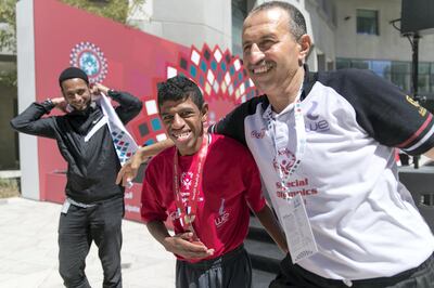 ABU DHABI, UNITED ARAB EMIRATES - MARCH 19, 2018. 
Maher Sherif Helmy from Egypt embraces his coach after winning third place for 50M Freestyle swim at IX MENA Special Olympic games held at NYU Abu Dhabi.


(Photo: Reem Mohammed/ The National)

Reporter:  Ramola Talwar
Section:  NA + SP