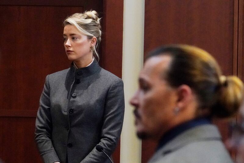 Amber Heard and Johnny Depp appear in court earlier this year. AP