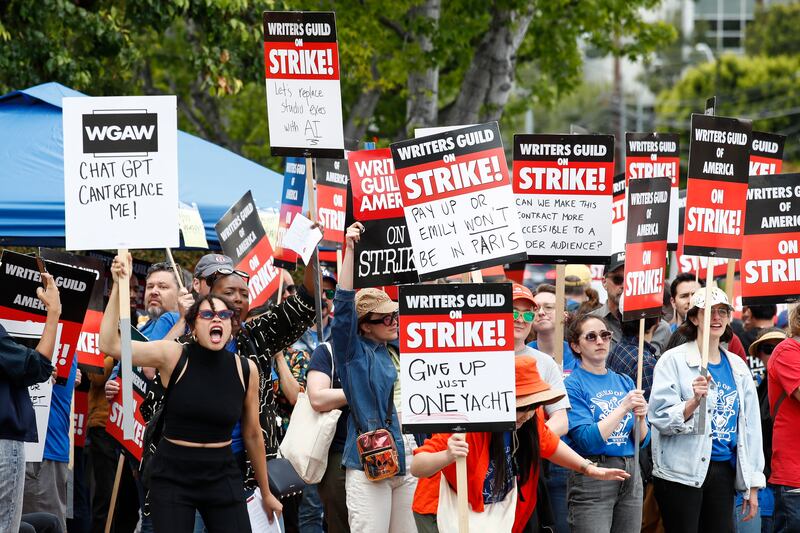 Members of the Writers Guild of America demonstrate in front of Walt Disney Studios in Burbank, California. Striking scriptwriters want better wages and working conditions. EPA 