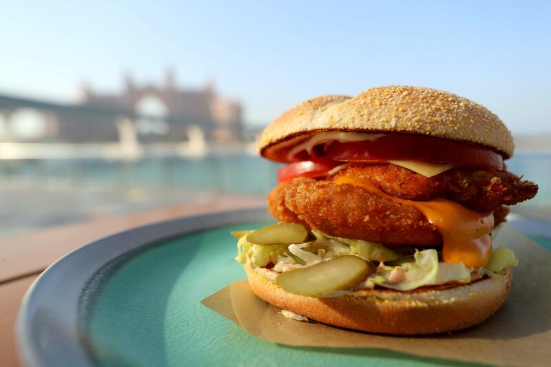 Dubai, United Arab Emirates - Reporter: Sophie Prideaux. Lifestyle. Food. Restaurant feature. Eat your way around The Pointe, The Palm. The Chicken Escalope Burger from Lads Burger. Monday, January 18th, 2021. Dubai. Chris Whiteoak / The National