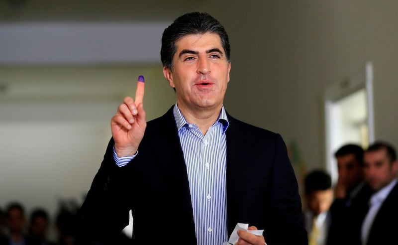 FILE PHOTO: Kurdistan Regional Government Prime Minister Nechirvan Barzani, just elected president of the regional government, shows his ink-stained finger after casting his vote at a polling station during parliamentary elections in the semi-autonomous region in Erbil, Iraq September 30, 2018. REUTERS/Thaier Al-Sudani/File Photo