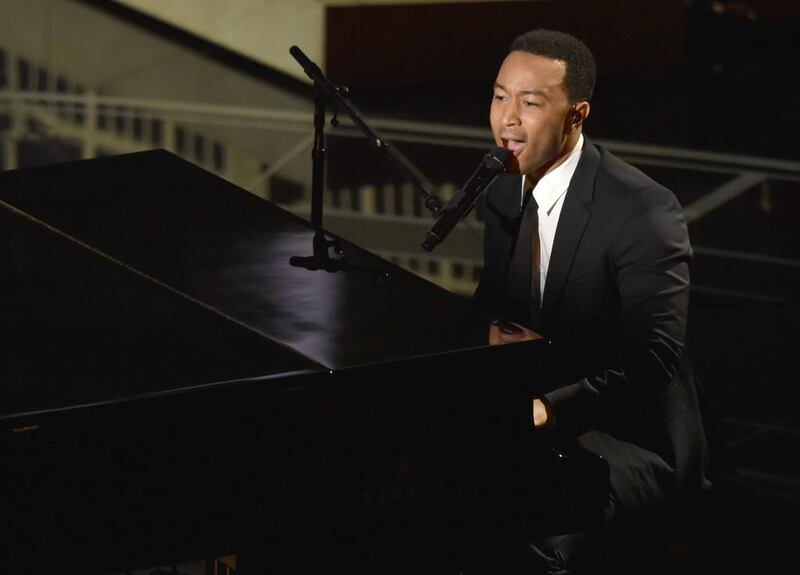 John Legend performs on stage at the Oscars on at the Dolby Theatre in Los Angeles. John Shearer / Invision / AP