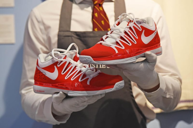 A pair of training shoes worn by Roger Federer on display during "The Roger Federer Collection" auction photocall at Christies in London.