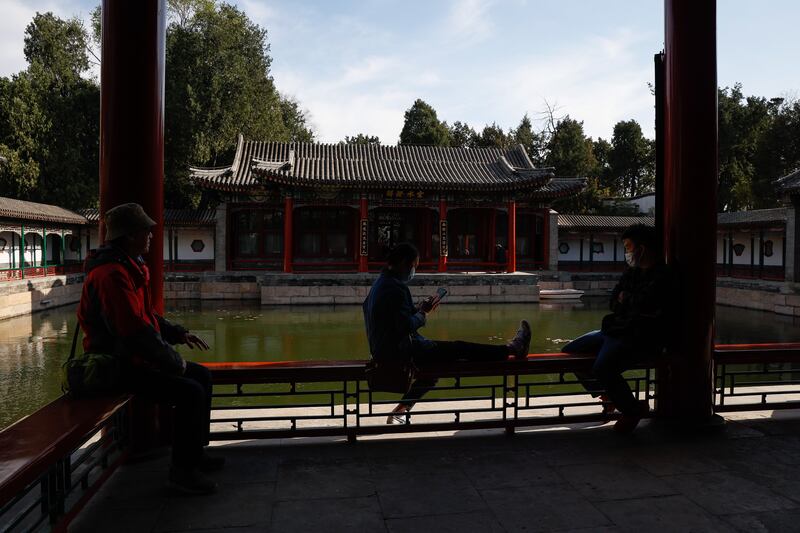 People rest at a temple at the Beihai Park in Beijing, China. EPA