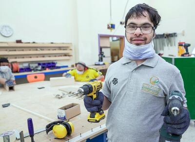 Abu Dhabi, United Arab Emirates, February 13, 2020.  
   Story Brief:  A story on the carpentry workshop at Zayed High Organisation for people of determination, where people with special needs aremaking tables and podiums that are used in government buildings and mosques. 

-- Khaled Abdelrahim with his favorite power tools at the carpentry workshop.

Victor Besa / The National
Section:  NA
Reporter:  Haneen Dajani