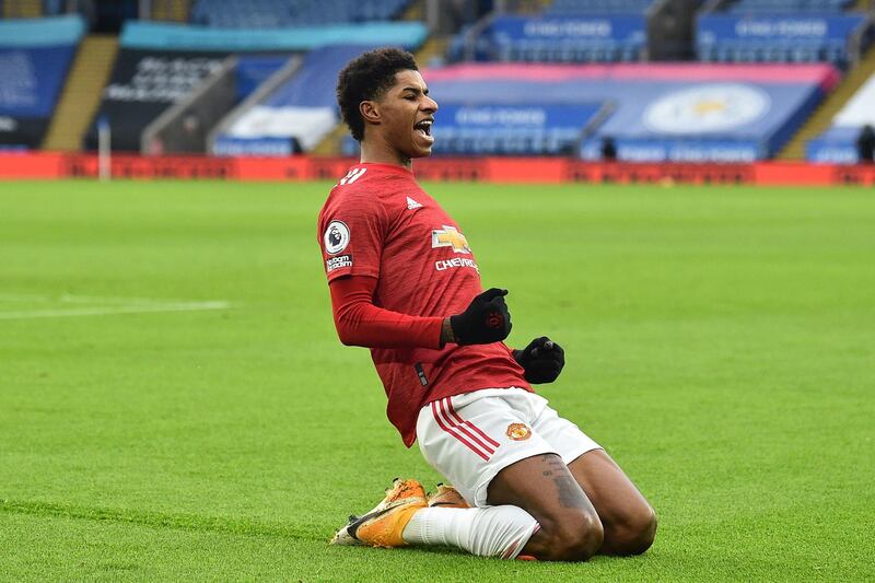 Manchester United's English striker Marcus Rashford celebrates after scoring the opening goal during the English Premier League football match between Leicester City and Manchester United at King Power Stadium in Leicester, central England on December 26, 2020. RESTRICTED TO EDITORIAL USE. No use with unauthorized audio, video, data, fixture lists, club/league logos or 'live' services. Online in-match use limited to 120 images. An additional 40 images may be used in extra time. No video emulation. Social media in-match use limited to 120 images. An additional 40 images may be used in extra time. No use in betting publications, games or single club/league/player publications.
 / AFP / POOL / Glyn KIRK                           / RESTRICTED TO EDITORIAL USE. No use with unauthorized audio, video, data, fixture lists, club/league logos or 'live' services. Online in-match use limited to 120 images. An additional 40 images may be used in extra time. No video emulation. Social media in-match use limited to 120 images. An additional 40 images may be used in extra time. No use in betting publications, games or single club/league/player publications.
