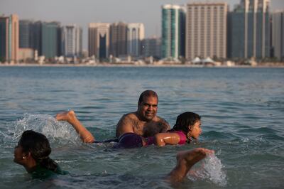 Abu Dhabi, United Arab Emirates, Oct. 13, 2013 /// 
A young girl learns to swim while enjoying her time outdoors at the Breakwater Corniche in Abu Dhabi, on Sunday, Oct. 13, 2013, the day before Arafat Day, and the official beginning of Eid Al Adha. (Silvia Razgova / The National)

Section:  
Publication: 
Reporter: Standalone


 *** Local Caption ***  SR-131013-eidaladha097.jpg