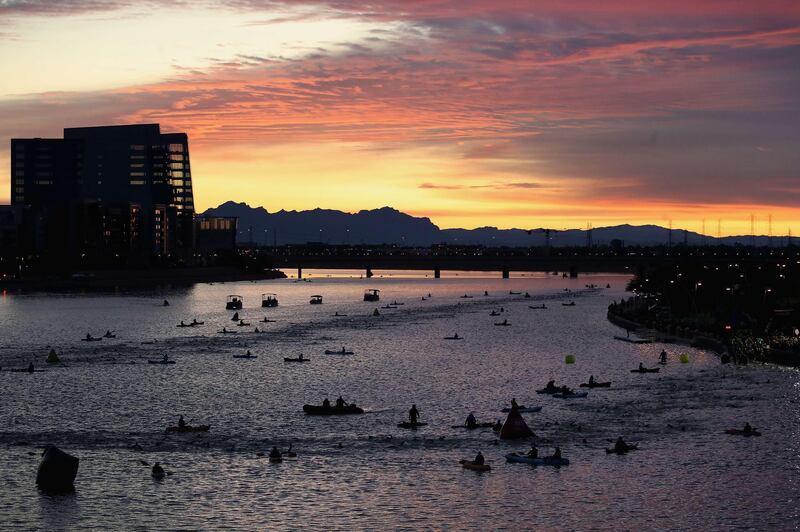COmpetitors enter the water to start the 2019 Dignity Health Medical Group IRONMAN Arizona on Sunday, November 24. AFP