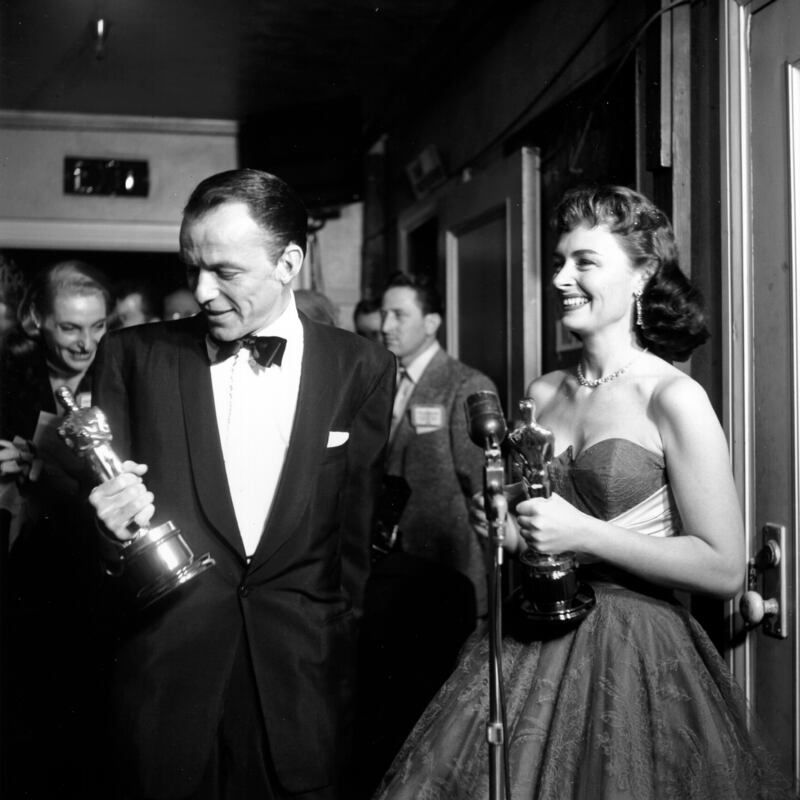Frank Sinatra admires his Best Supporting Actor Oscar for  From Here To Eternity at the 1954 Academy Awards