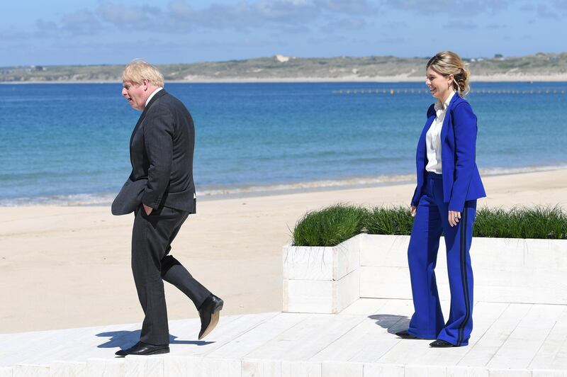 Johnson paired the look with a crisp white shirt and black Christian Louboutin stilettoes. Reuters