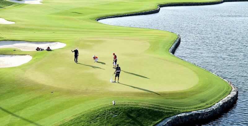 KING ABDULLAH ECONOMIC CITY, SAUDI ARABIA - FEBRUARY 03: Dustin Johnson of the USA celebrates on the 18th green during the final round of the Saudi International at the Royal Greens Golf & Country Club on February 03, 2019 in King Abdullah Economic City, Saudi Arabia. (Photo by Ross Kinnaird/Getty Images)