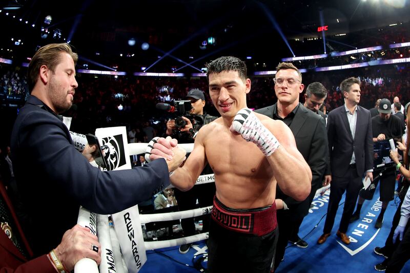 Dmitry Bivol celebrates after his unanimous-decision victory against Canelo Alvarez after their WBA light heavyweight title fight at T-Mobile Arena.