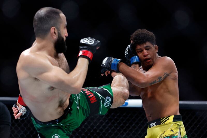 Belal Muhammad attempts a kick on Gilbert Burns during their welterweight bout at UFC 288. AFP