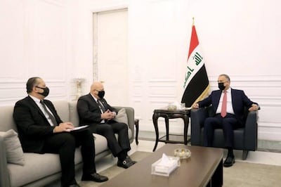 Karim Khan, centre, once headed a UN team to investigate ISIS war crimes in Iraq. Here he meets Iraq's Prime Minister Mustafa Al Kadhimi. Unitad