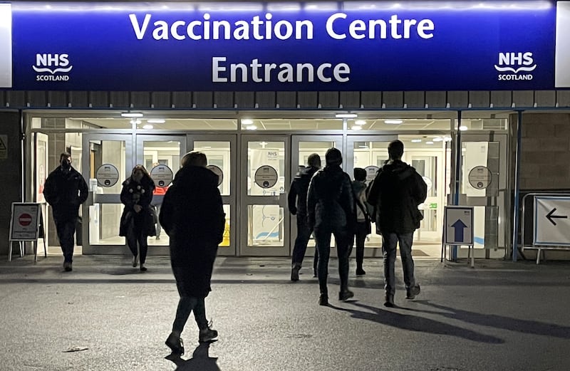 Members of the public arrive for vaccinations and boosters at the NHS Scotland Vaccine Centre in Edinburgh. PA