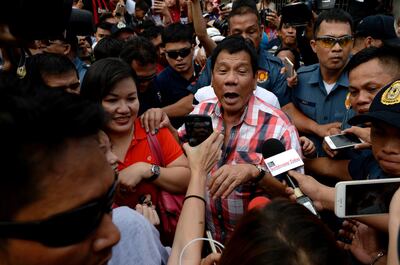Then Davao City mayor Rodrigo Duterte leaves the voting precinct after casting his vote in Davao City, on the southern island of Mindanao, in 2016. AFP