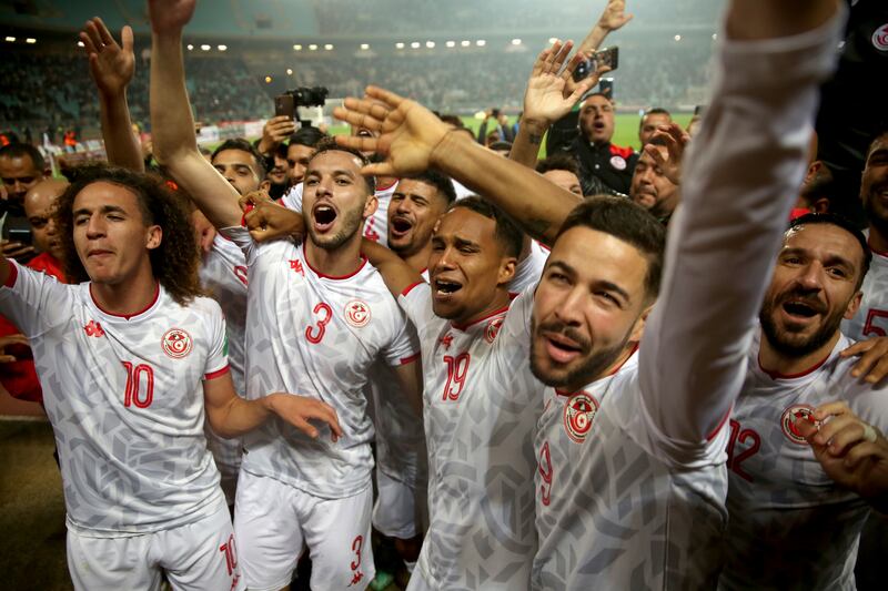 Tunisia players celebrate after beating Mali. AP