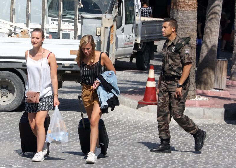 epa07836855 Tourists are evacuated from the Acapulco hotel east of the city of Kyrenia, northern Cyprus, 12 September 2019. An ammunition depot in northern Cyprus exploded on Thursday after a fire broke out in a military zone. Shattered glass injured some people during the incident, and the hotel was evacuated.  EPA/KATIA CHRISTODOULOU