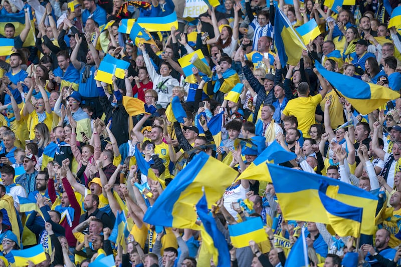 Ukraine fans celebrate after Andriy Yarmolenko scores. PA