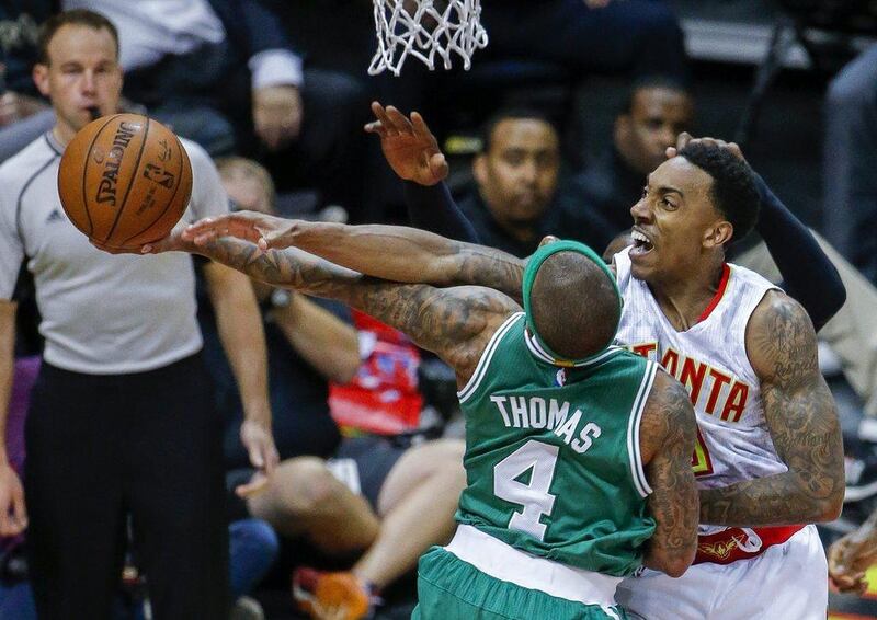 Jeff Teague of the Atlanta Hawks, rights, defends Isaiah Thomas of the Boston Celtics during Game 2 of their NBA play-offs series on Tuesday night. Erik S Lesser / EPA / April 19, 2016