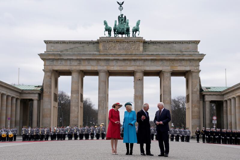 German President Frank-Walter Steinmeier (R) and his wife Elke Buedenbender (L) welcome Britain's King Charles III and the Queen Consort Camilla at Brandenburg Gate in Berlin, part of the royal couple's three-day official visit to Germany. AP