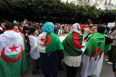 Algerians carry a huge national flag as they chant slogans as they march in a protest during the presidential elections, in Algeria, Algeria, 12 December 2019. Five candidates are running in the 12 December presidential elections, the first since the resignation of president Abdelaziz Bouteflika in April under pressure from protesters. EPA/MOHAMED MESSARA