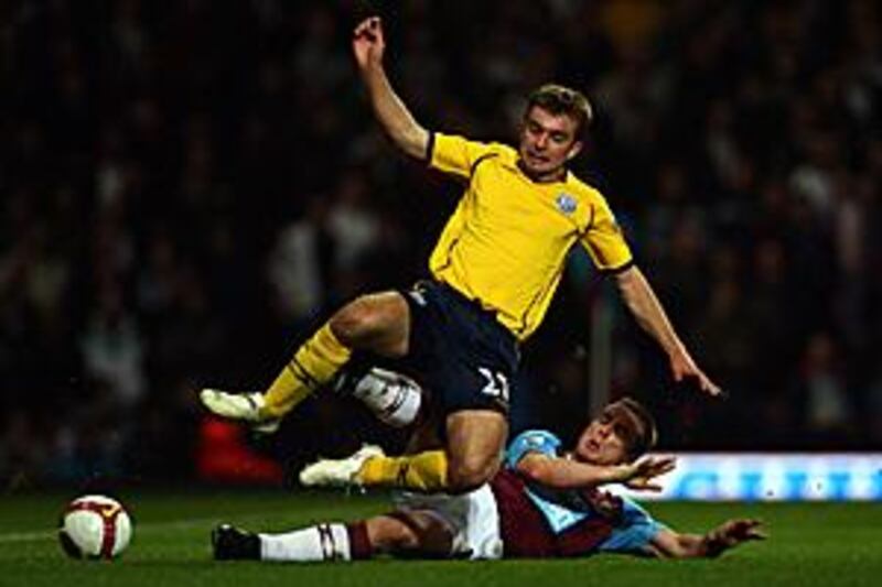 West Brom's James Morrison rides the tackle from West Ham's Scott Parker during the two side's dour 0-0 draw at Upton Park.