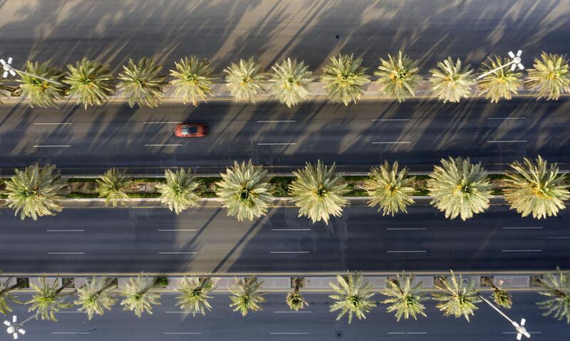 An aerial view shows a section of the nearly-deserted King Fahad road due to the COVID-19 pandemic, on the first day of the Eid al-Fitr feast marking the end of the Muslim holy month of Ramadan, in the Saudi capital Riyadh, on May 24, 2020. - Saudi Arabia, home to Islam's holiest sites, began a five-day round-the-clock curfew from May 23, in a bid to stem the spread of the novel coronavirus. (Photo by FAISAL AL-NASSER / AFP)