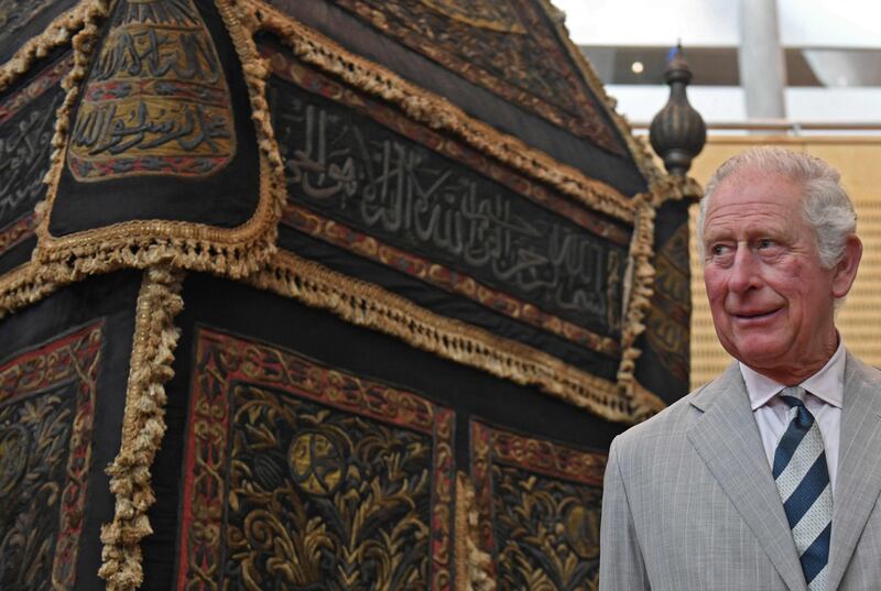 Prince Charles stands next to the mahmal, the palanquin used to transport the kiswah that covers the Kaaba in Makkah, during a visit to Alexandria, Egypt, in 2021. AFP