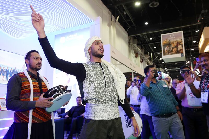 Performers entertain the crowds at the bustling conference. Chris Whiteoak / The National