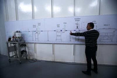 An engineer gives a brief at a part of the International Research Centre SESAME ( Synchrotron-light for Experimental Science and Applications in the Middle East) near Amman, Jordan. ( Salah Malkawi for The National)