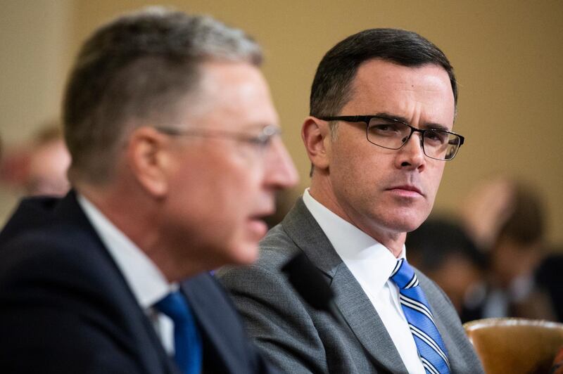 epaselect epa08010200 Former Senior Director for Europe and Russia at the National Security Council, Tim Morrison (R); listens to testimony from former US Special Representative for Ukraine Kurt Volker (L); during the House Permanent Select Committee on Intelligence public hearing on the impeachment inquiry into US President Donald J. Trump, on Capitol Hill in Washington, DC, USA, 19 November 2019. The impeachment inquiry is being led by three congressional committees and was launched following a whistleblower's complaint that alleges US President Donald J. Trump requested help from the President of Ukraine to investigate a political rival, Joe Biden and his son Hunter Biden.  EPA/MICHAEL REYNOLDS