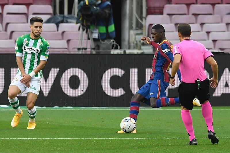 Barcelona's forward Ousmane Dembele scores against Real Betis at Camp Nou. AFP