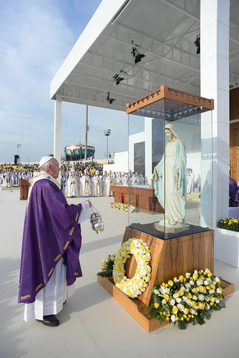 Pope Francis blesses a statue of the Virgin Mary at a mass at the Franso Hariri Stadium. EPA