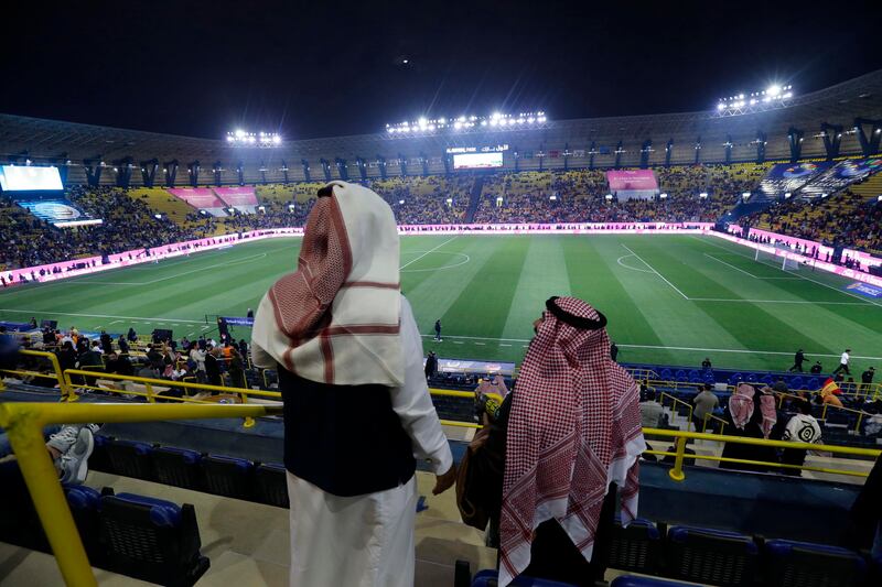 Fans wait for the Super Cup match between Galatasaray and Fenerbahce at Al Awal Park in Riyadh, Saudi Arabia, on Friday before its postponement. AP