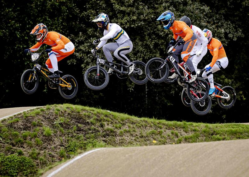 Dutch cyclist Niek Kimmann, left, on his way to victory at the BMX World Championship at the National Sports Centre Papendal in Arnhem, Netherlands, on Sunday, August 22. AFP
