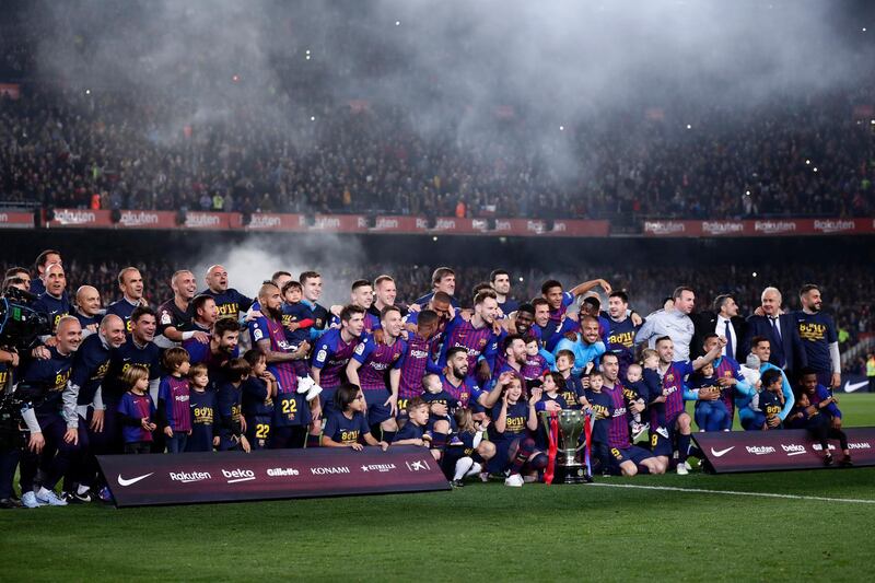 Barcelona players and their families celebrate their league success after defeating Levante. AP Photo