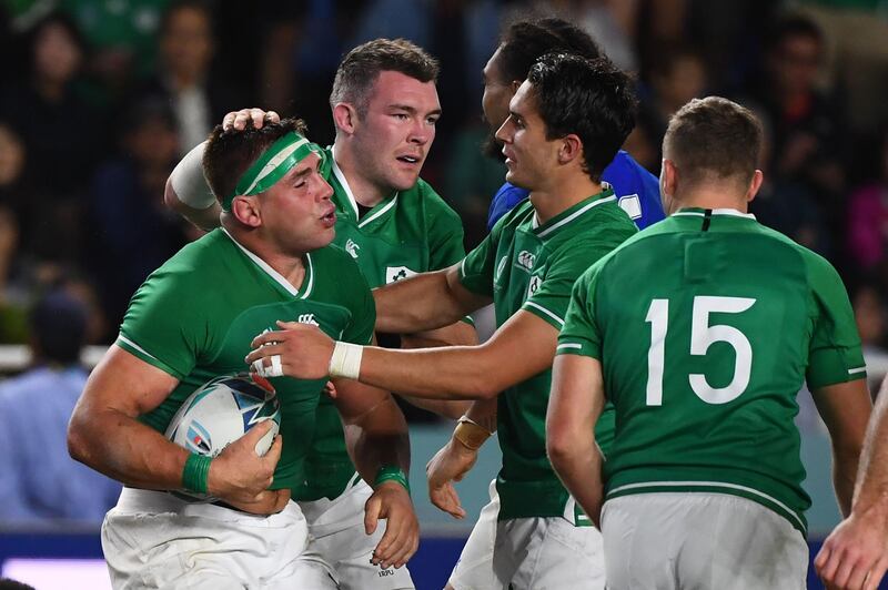 Ireland's number 8 CJ Stander (L) reacts after scoring a try  during the Japan 2019 Rugby World Cup Pool A match between Ireland and Samoa at the Fukuoka Hakatanomori Stadium in Fukuoka on October 12, 2019.  / AFP / GABRIEL BOUYS                     

