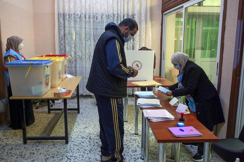 Libyans cast their ballots during the second round of municipal elections, at a voting center in the Andalus neighbourhood of the capital Tripoli.  AFP