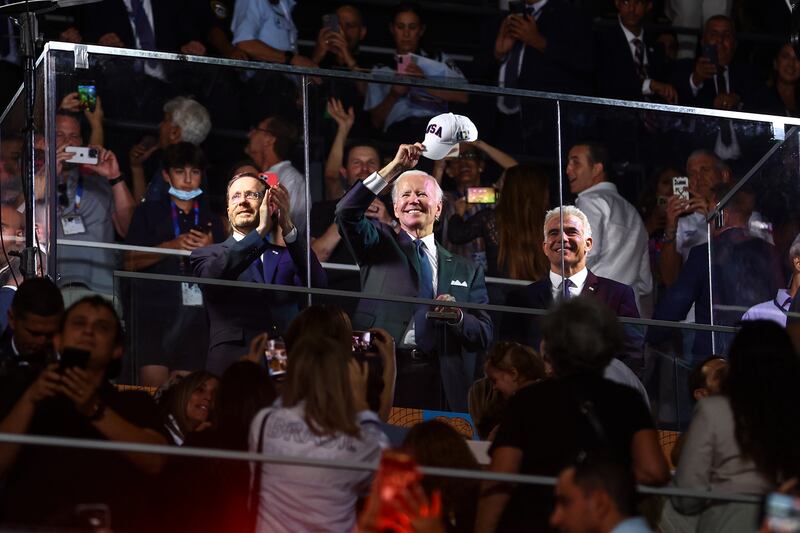 US President Joe Biden stands next to Israeli Prime Minister Yair Lapid, right, and Israeli President Isaac Herzog during the opening ceremony of the Maccabiah Games in Jerusalem last week. EPA